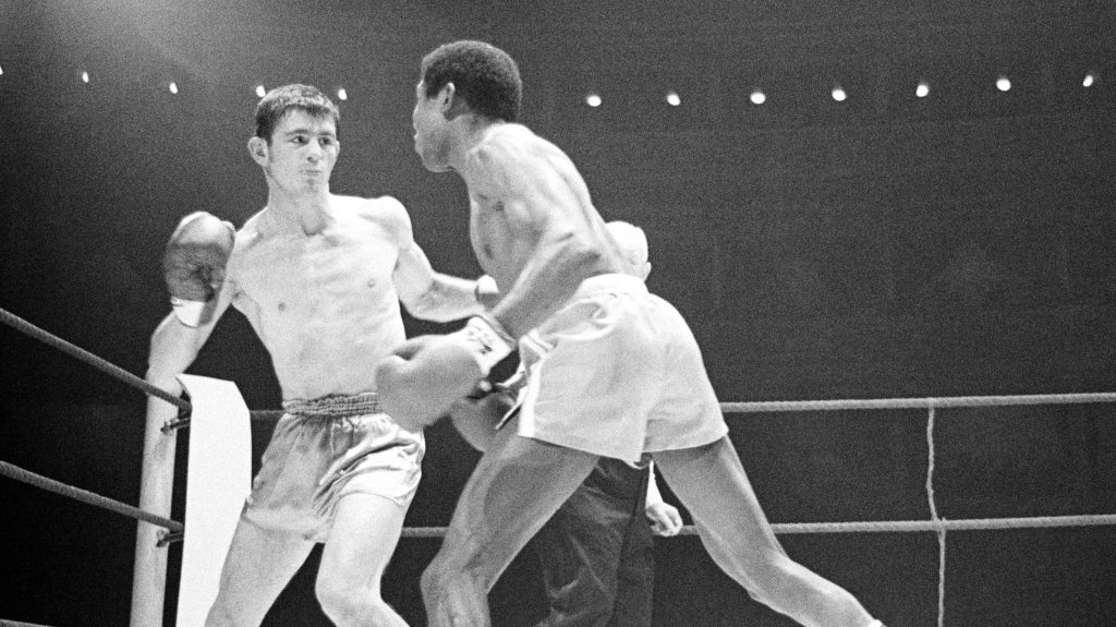 Cuban-born Spaniard Jose Legra, right, attempts to land a left hook to the head of Australian boxer Johnny Famechon during their World Featherweight Title fight, at the Royal Albert Hall, London, Jan. 21, 1969. Famechon won the title on a points decision. (AP)