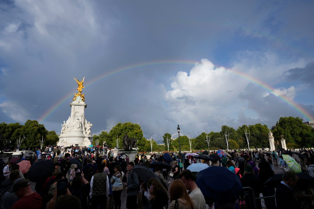 Thumbnail for Rainbows, silence before crowds sing God Save the Queen near palace