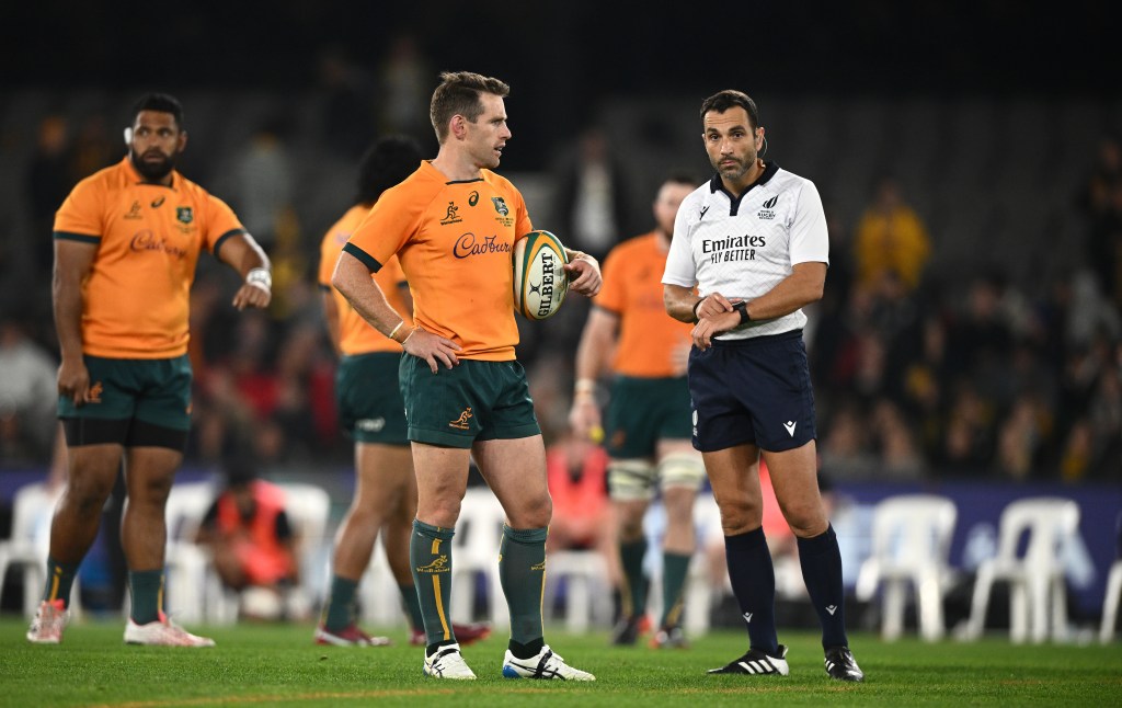 Wallabies player Bernard Foley with referee Mathieu Raynal in the closing stages of the match between Australia and New Zealand at Marvel Stadium in Melbourne. (AAP Image/Joel Carrett) 