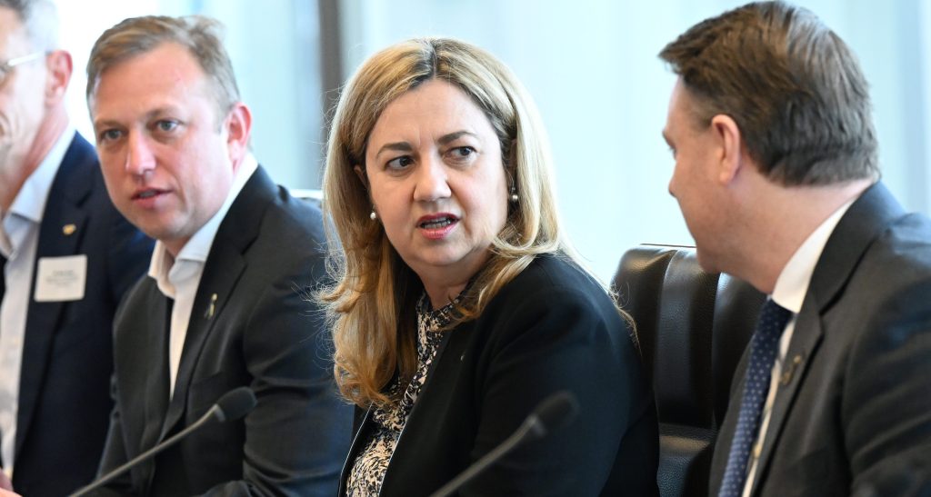 Next in line: Deputy Premier Stephen Miles with Premier Annastacia Palaszczuk (centre). (AAP Image/Darren England) 