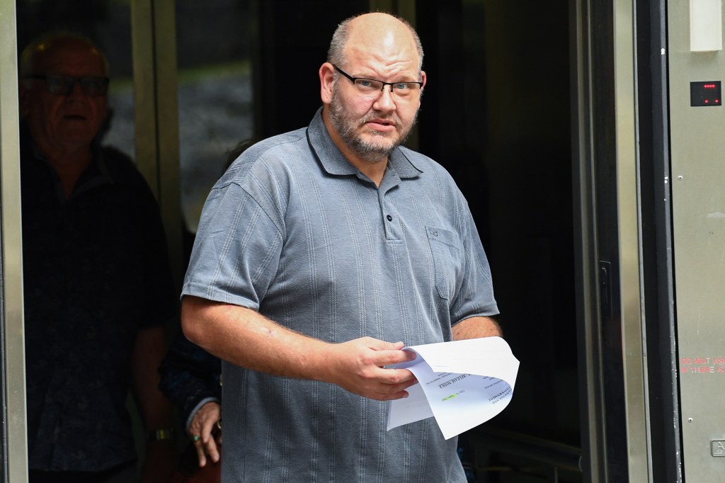 Adam William Cheal departs the Brisbane Magistrate's Court. (AAP Image/Jono Searle) 