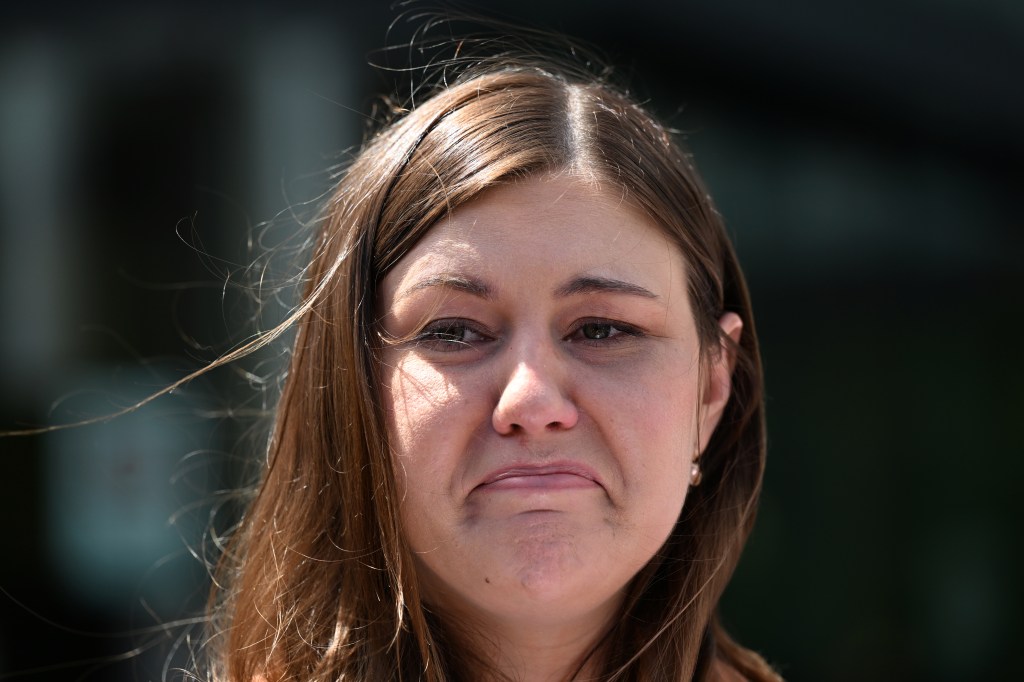 Former Liberal Party staffer Brittany Higgins makes a statement after leaving the ACT Supreme Court in Canberra. (AAP Image/Mick Tsikas) 