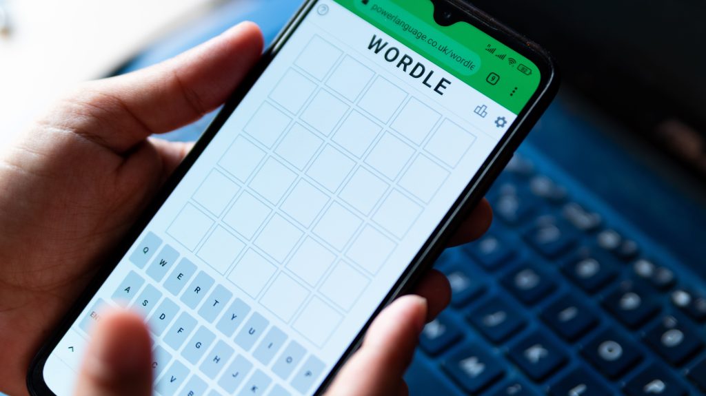 In this photo illustration the online word game Wordle is seen on the screen of a mobile phone. (Photo by Davide Bonaldo / SOPA Images/Sipa USA)