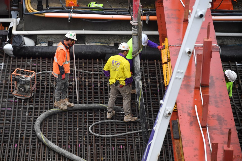 Workers are seen on a building site at Barangaroo Point in Sydney. The seasonally adjusted estimates for the May 2021 quarter show total job vacancies were 362,500, an increase of 23.4% from February 2021. (AAP Image/Mick Tsikas) 