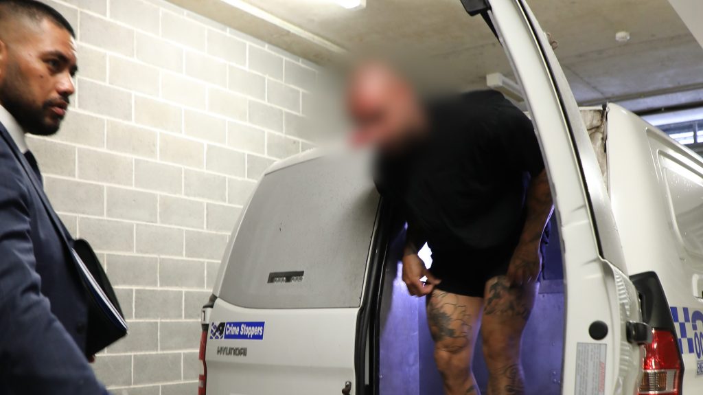 A supplied image shows a senior OMCG member arrested by Gold Coast Major and Organised Crime Squad officers on the Gold Coast, Thursday, February 9, 2023. (AAP Image/Supplied by NSW Police) 