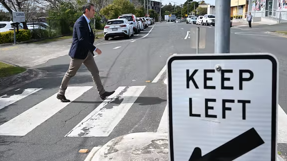 ederal Treasurer Jim Chalmers crossing the road outside the Logan Diggers Services Club in Logan, Queensland, August 2022. Glenn Campbell/AAP