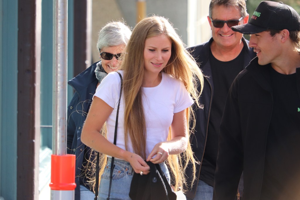 Former Australian of the Year Grace Tame with partner Max Heerey outside the Hobart Magistrates Court. The man who sexually abused Tame as a child faced court for allegedly harassing her via social media. (AAP Image/Ethan James) 