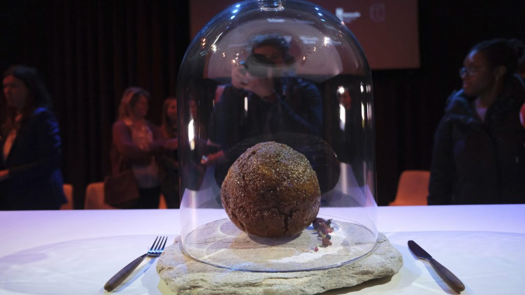 A meatball made using genetic code from the mammoth is seen at the Nemo science museum in Amsterdam, Tuesday March 28, 2023. An Australian company has lifted the glass cloche on a meatball made of lab-grown cultured meat using the genetic sequence from the long-extinct mastodon. The high-tech treat isn't available to eat yet - the startup says it is meant to fire up public debate about cultivated meat. (AP Photo/Mike Corder)