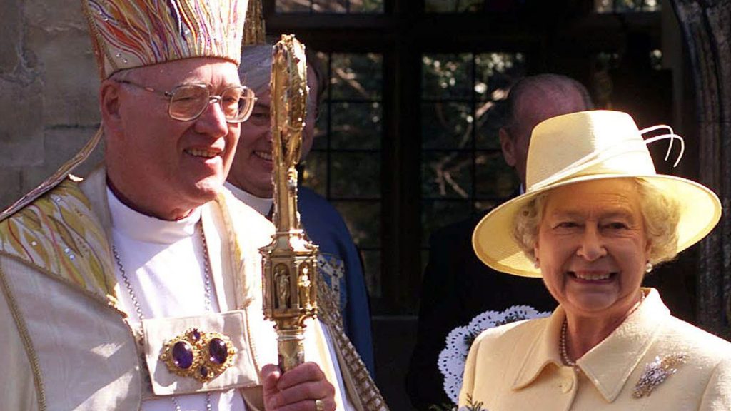 Britain's Queen Elizabeth II and the Archbishop of Canterbury, Doctor George Carey, stand outside the Deanery at Canterbury Cathedral after attending a Royal Maunday service, Thursday  March 28, 2002.  (AP Photo/ Fiona Hanson/POOL)