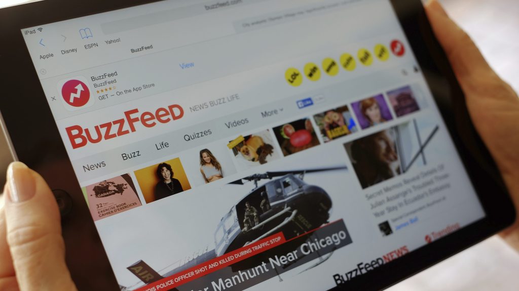 Media company BuzzFeed is cutting 15 percent of its jobs, or about 200 people, to trim costs and become profitable.  (AP Photo/Richard Vogel, File)