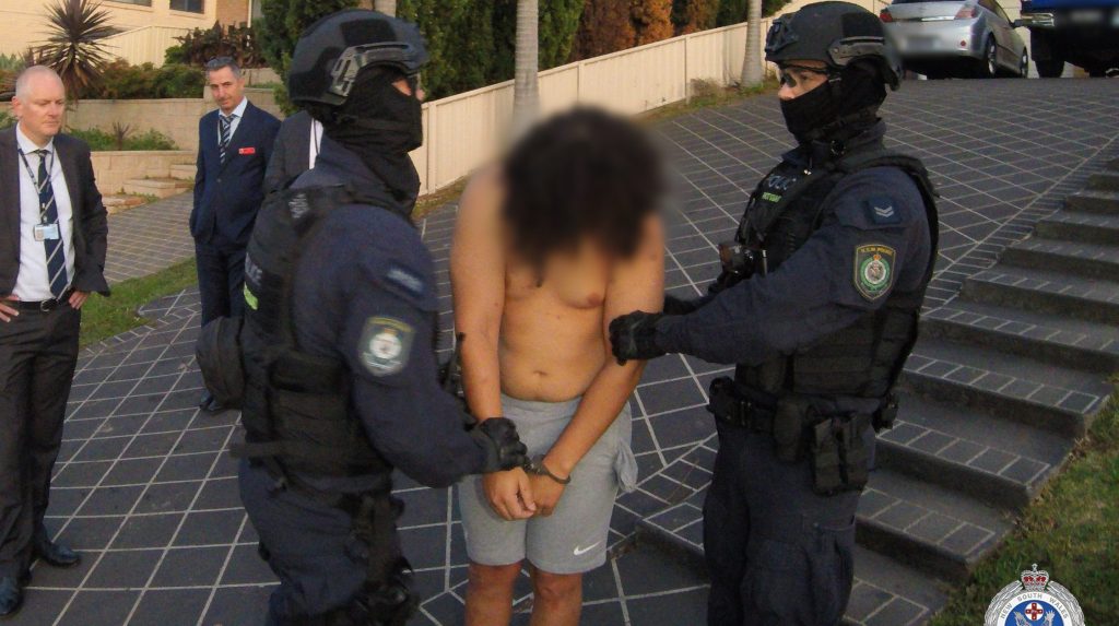 A supplied image shows NSW police raiding a home in Sydney's southwest, arresting a 25-year-old man who is charged with the murder of former bikie Yusuf Nazlioglu, Wednesday, April 19, 2023. (AAP Image/Supplied by NSW Police) 
