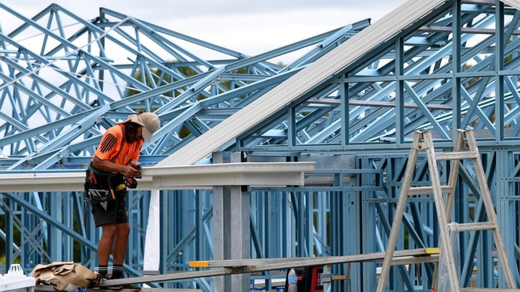 Roofer, Troy Phillips is seen constructing a new home in a housing estate at Coomera, on the Gold Coast, (AAP Image/Darren England)