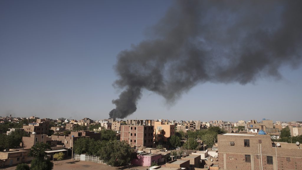 Smoke is seen in Khartoum, Sudan, Wednesday, April 19, 2023. More than 200 Australians have been airlifted out of the war-torn country. (AP Photo/Marwan Ali, File)