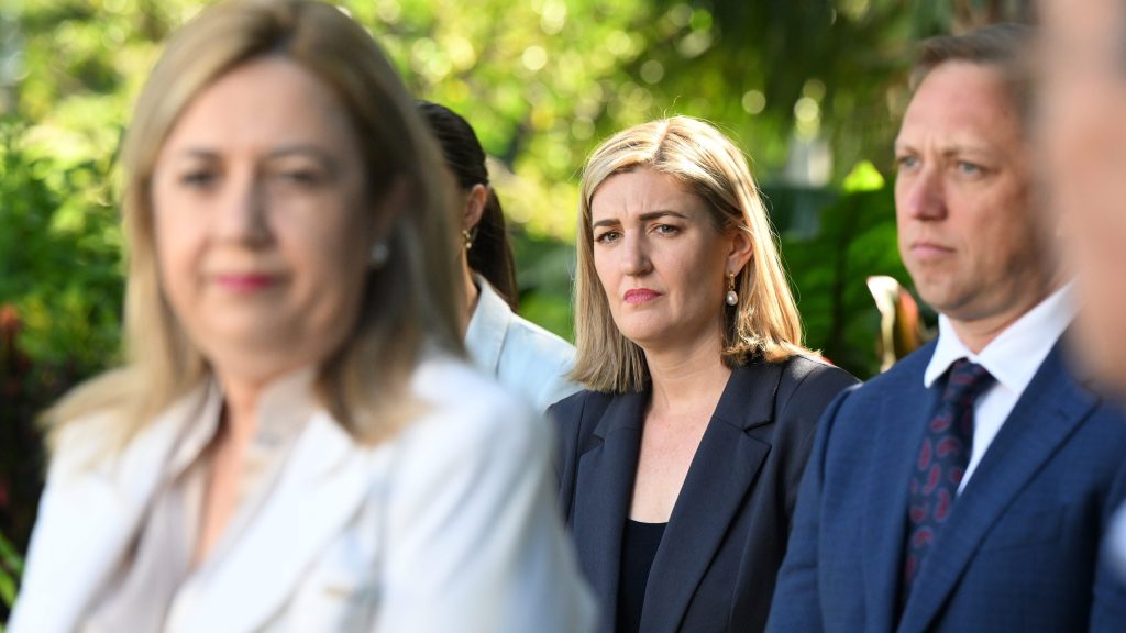 Shannon Fentiman (centre), the new Queensland Minister for Health and Ambulance Services, Mental Health and Women looks on as Queensland Premier Annastacia Palaszczuk (left) speaks during a press conference after a swearing-in ceremony following a cabinet reshuffle, at Government House in Brisbane. (AAP Image/Darren England)