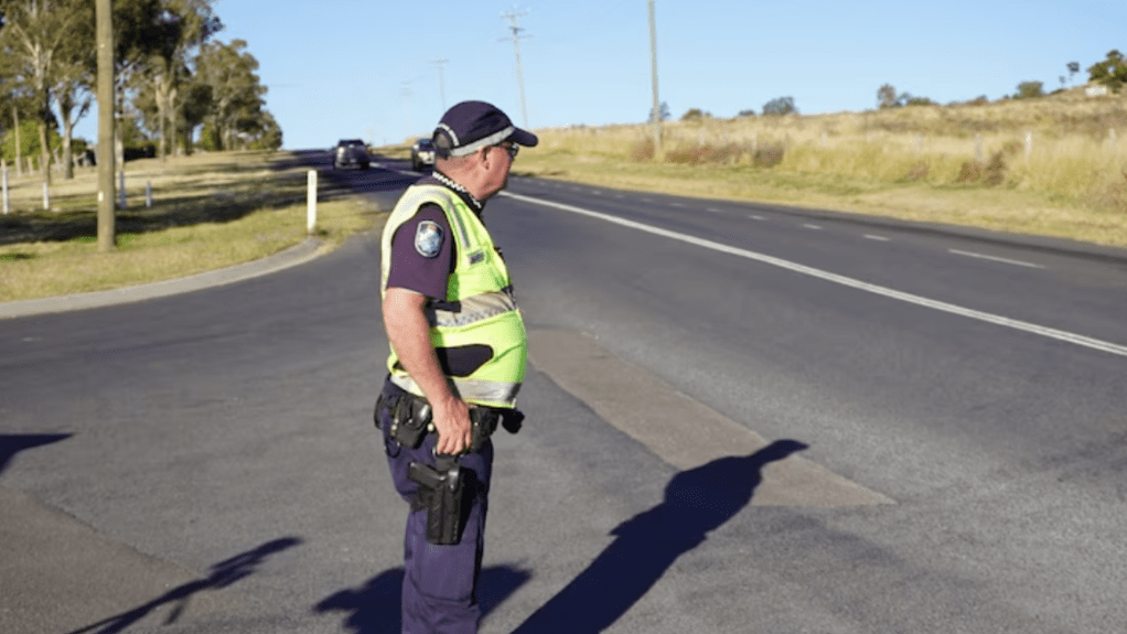 Police at the scene of an alleged hit-and-run by a driver in a stolen truck near Toowoomba. (ABC image)