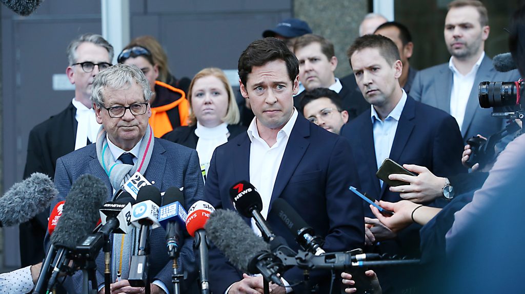 Journalists (L-R) Chris Masters, Nick McKenzie and Nine Newspapers managing director of publishing James Chessell, speak to media after the Ben Roberts-Smith trial at the Federal Court of Australia in Sydney. (AAP Image/Jane Dempster) 