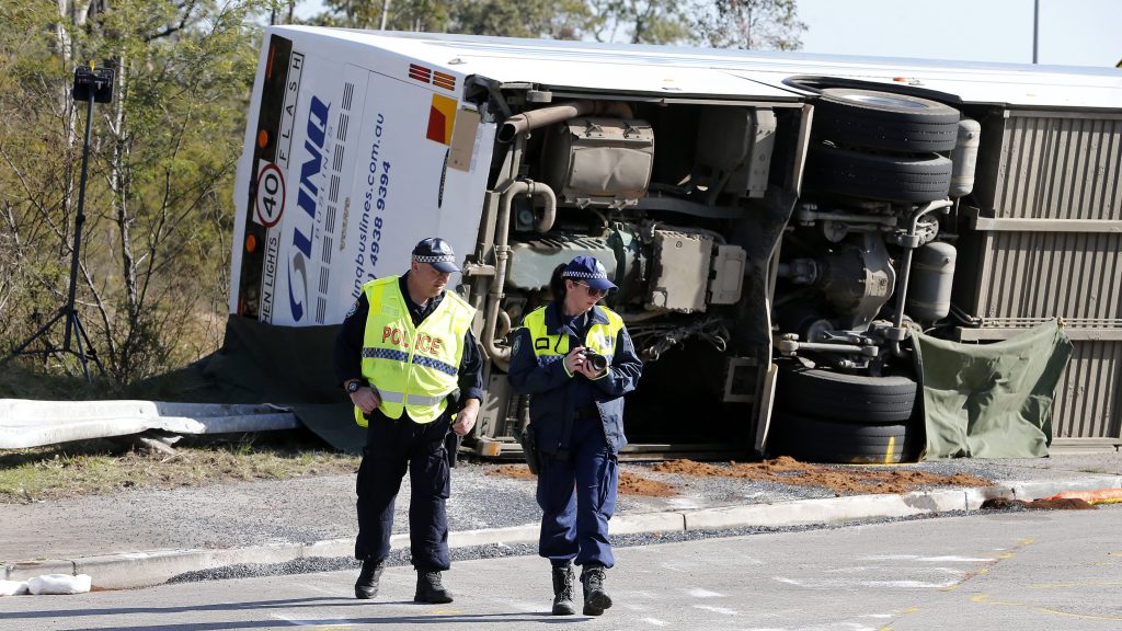 Investigators at the scene of a bus crash near Greta in the NSW Hunter Valley, Australia. Monday, June 12, 2023.  (AAP Image/Darren Pateman) 