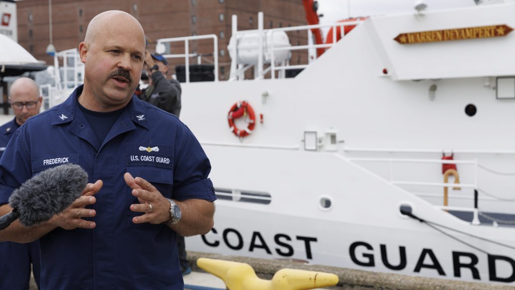 epa10702217 Capt. Jamie Frederick, the First Coast Guard District takes questions during news conference regarding the ongoing search for a submersible, on the pier at Coast Guard Base Boston, in Boston, Massachusetts, USA, 20 June 2023. The United States Coast Guard, along with Canadian authorities, is searching the ocean depths for a submersible with Ocean Gate Expeditions, carrying tourists visiting the Titanic wreckage, 900 miles (1500 km) off the coast of Cape Cod, that lost contact on 18 June 2023.  EPA/CJ GUNTHER
