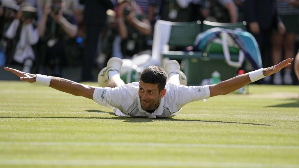 Novak Djokovic celebrates after beating Australia's Nick Kyrgios to win the final of the men's singles at Wimbledon (AP Photo/Alastair Grant, File)