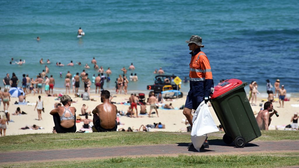 A council worker collects rubbish bins (AAP Image/Mick Tsikas) 