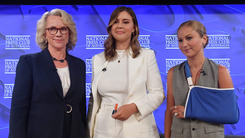 ABC journalist Laura Tingle, 2021 Australian of the Year Grace Tame and advocate for survivors of sexual assault Brittany Higgins at the National Press Club in Canberra, Wednesday, February 9, 2022. (AAP Image/Mick Tsikas)