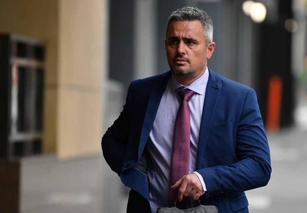 Senior police detective Murray Gentner arrives at the Magistrates' Court of Victoriac contest hearing for he and officer Shane Reid, charged over the leak of photos of former AFL coach Dani Laidley in police custody. (AAP Image/Joel Carrett) 