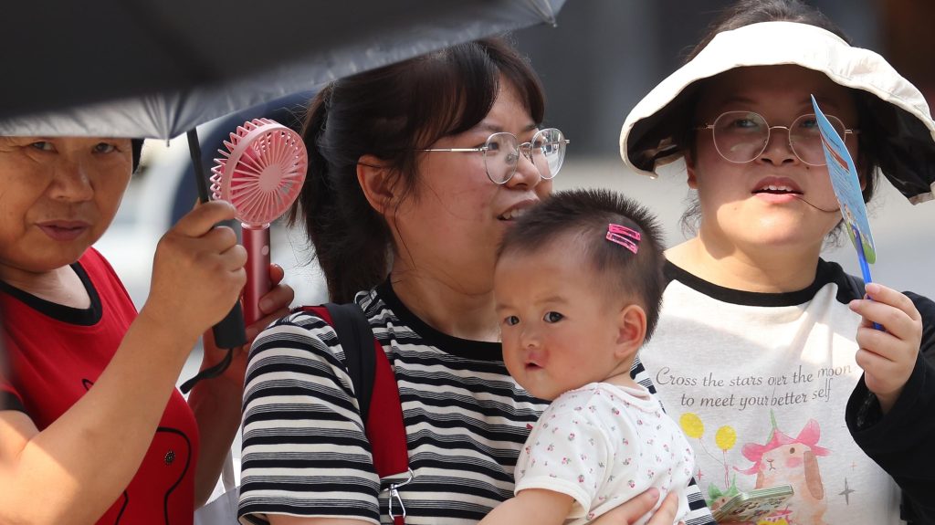 People travel out amid hot weather in Nanjing City, east China's Jiangsu Province, 6 July, 2023. (Photo by ChinaImages/Sipa USA)