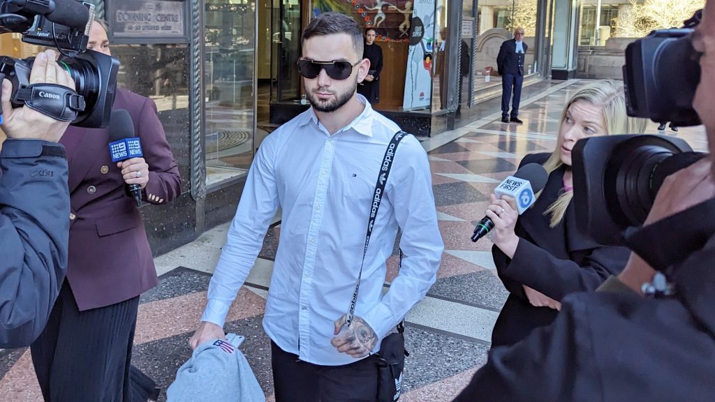 Christopher Walker departs the Downing Centre, Sydney. (AAP Image/Miklos Bolza)