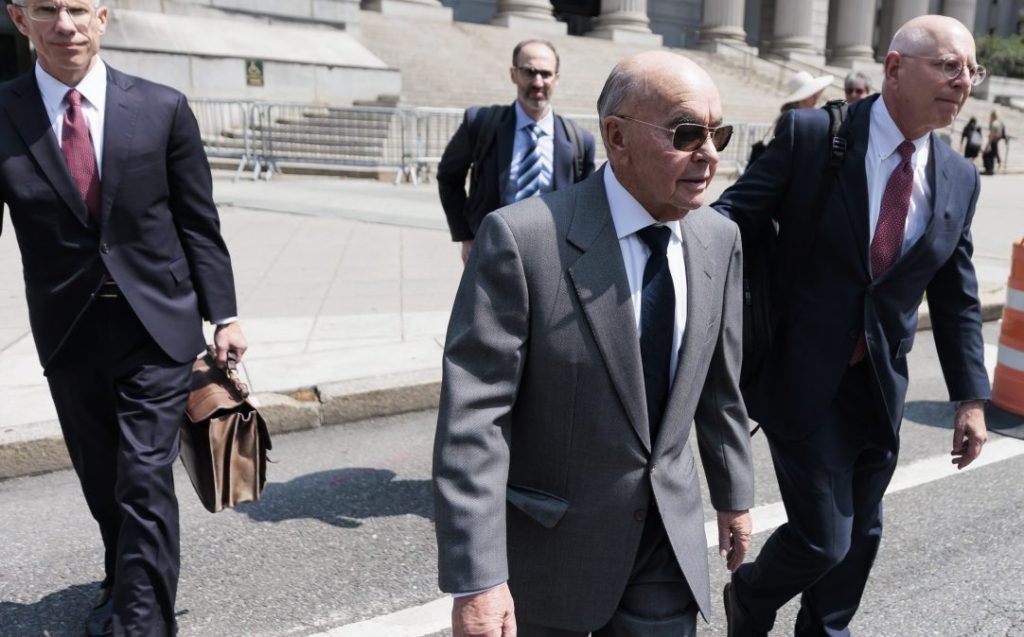  British billionaire and Tottenham Hotspur football team owner Joe Lewis (2-R) walks with his legal team after surrendering to authorities to face an indictment on insider trading charges at United States federal court in New York.  Federal prosecutors are accusing Lewis of providing confidential stock information to friends and associates.  EPA/JUSTIN LANE