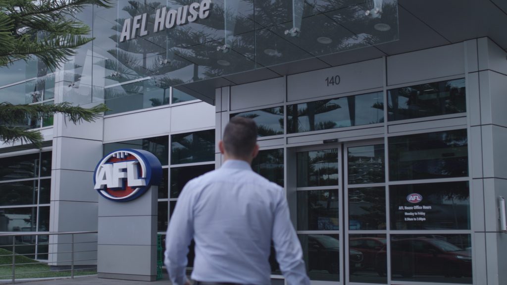An employee at AFL headquarters, where the code has launched an urgent probe into the publication of 'intimate' players' photographs online. (Image: AFL)