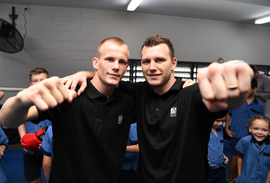 Former world champion Australian boxer Jeff Horn poses with fellow boxer Liam Wilson at a PCYC gym in Brisbane. PCYCs will get additional funding as an outlet for youth criminals (AAP Image/Dan Peled) 