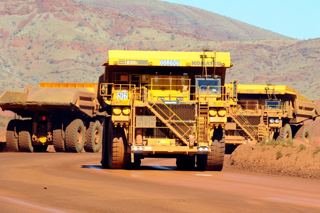 Haulage trucks at the Rio Tinto West Angelas iron ore mine in the Pilbara region of West Australia Wednesday, July 9, 2014.  (AAP Image/Alan Porritt) 