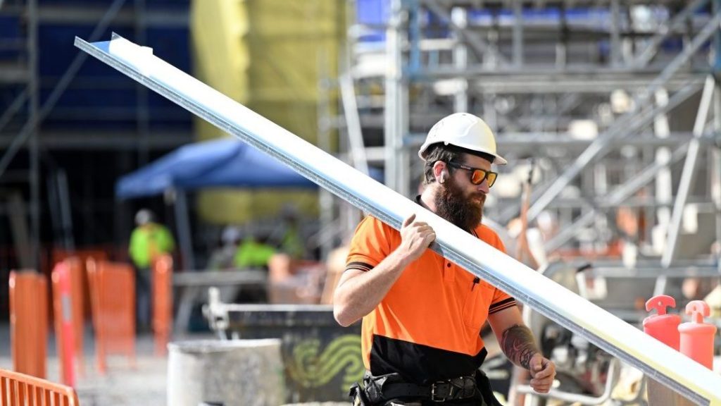 A worker is seen at a new housing building development in Brisbane(AAP Image/Darren England) 