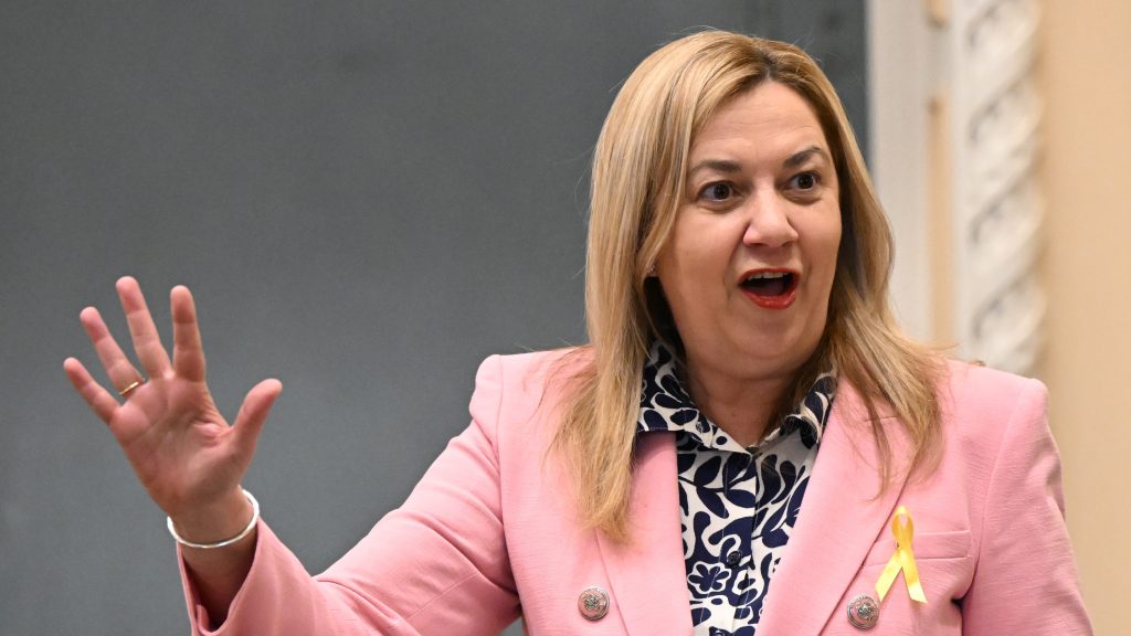 Not drowning, waving: Queensland Premier Annastacia Palaszczuk is seen during Question Time at Queensland Parliament House, in Brisbane after returning to work this week.  (AAP Image/Darren England)