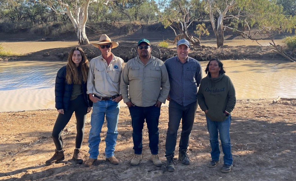 A supplied image obtained on Thursday, September 14, 2023, of those involved in the sale of the station pose for a photo at Thargomindah Station Left to right: Casey Taylor – Conscious Investment Management; Adam Klein – former owner of Thargomindah Station Ronald Saltner – Kullilli Bulloo River Aboriginal Corporation; Glenn Kvassay – Climate Friendly Cassandra Stevens – Kullilli Bulloo River Aboriginal Corporation, at Thargomindah Station, south western QLD. (AAP Image/Supplied) NO ARCHIVING, EDITORIAL USE ONLY