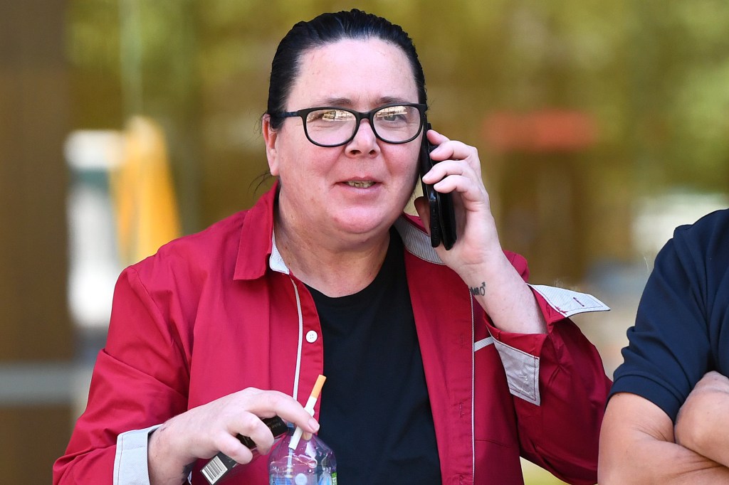 Angela McKinnon leaves the Brisbane District Court in Brisbane, Wednesday, September 27, 2023. (AAP Image/Jono Searle) 