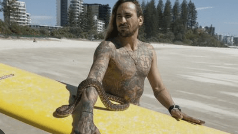 A man's pet snake has cost him more than $2000 for taking it for a surf with him. (Image, channel 9_
