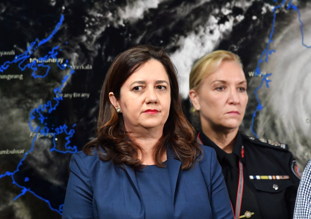 Former Queensland Premier Annastacia Palaszczuk (left) and then-Queensland Fire and Emergency Services Commissioner, Katarina Carroll (right) are seen during a press conference after the meeting of the Queensland Disaster Management Committee at the Emergency Services Complex in Brisbane.  (AAP Image/Darren England) 