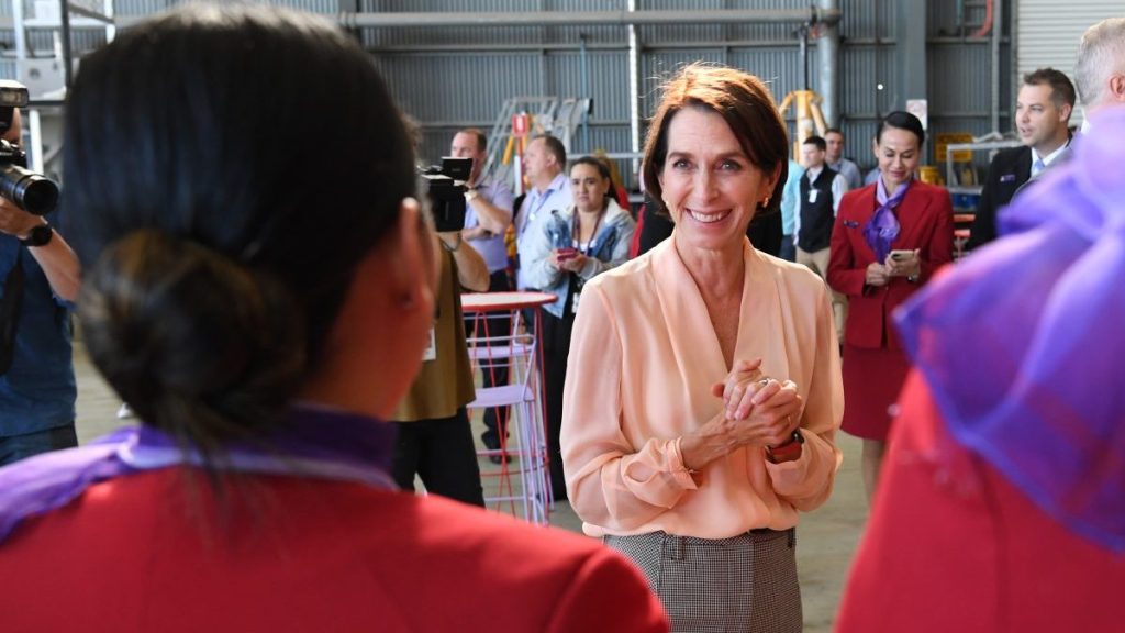 Virgin Australia Group CEO Jayne Hrdlicka (centre) is seen talking to staff at Brisbane Airport in Brisbane (AAP Image/Darren England) 