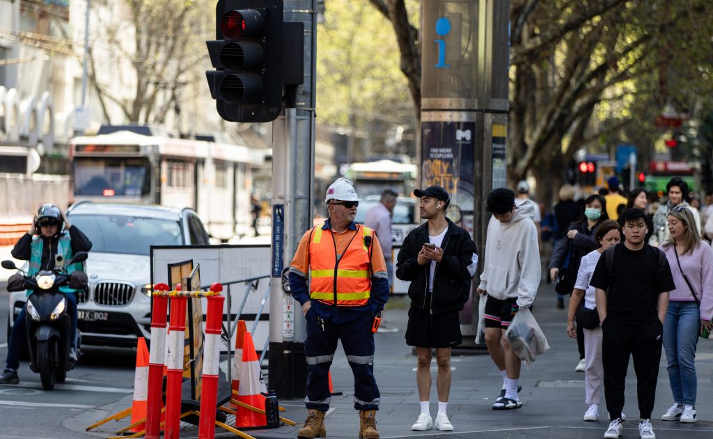 Construction workers are seen in the Central Business District in Melbourne, Friday, September 15, 2023. (AAP Image/Diego Fedele) NO ARCHIVING