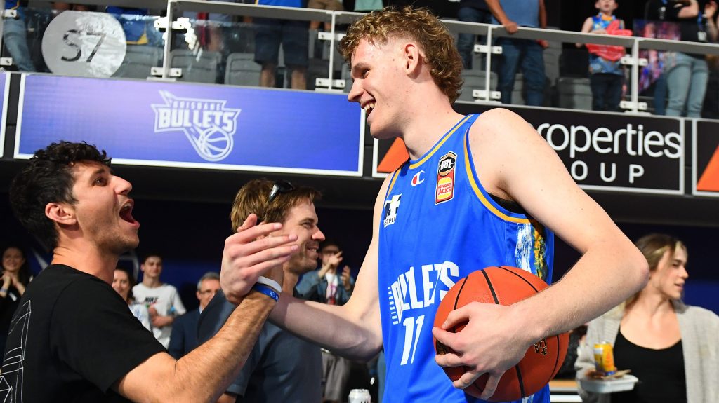 Rocco Zikarsky of the Bullets celebrates with fans after winning the round 1 NBL match between the Brisbane Bullets and Adelaide 36ers at Nissan Arena in Brisbane, Friday, September 29, 2023. (AAP Image/Jono Searle) 