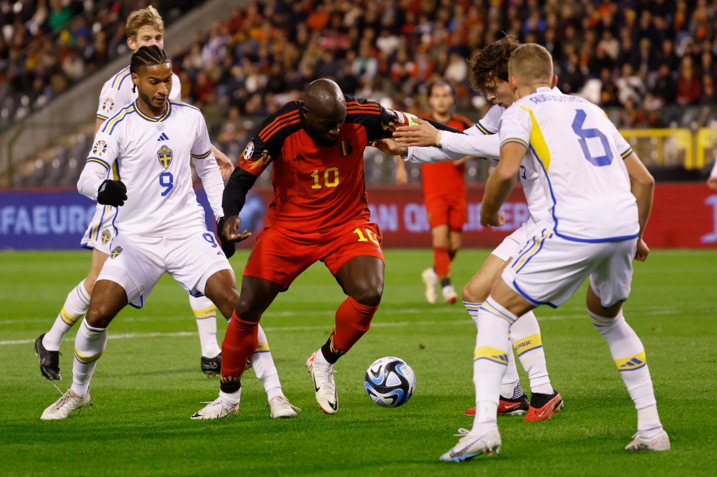 Belgium's Romelu Lukaku, centre, is surrounded by Sweden players during the Euro 2024 group F qualifying soccer match between Belgium and Sweden at the King Baudouin Stadium in Brussels, Monday, Oct. 16, 2023. (AP Photo/Geert Vanden Wijngaert)