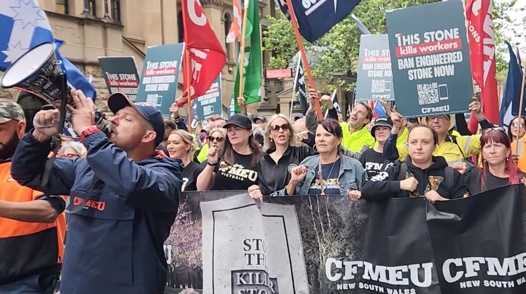 A CFMEU rally in Sydney demanding engineered stone be banned. (AAP Image/Luke Costin) 