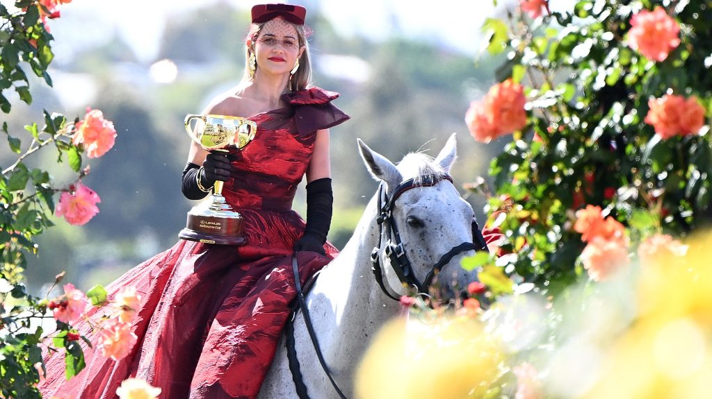 Jockey Michelle Payne arrives with the Melbourne Cup during the launch of the 2023 Melbourne Cup Carnival,.. (AAP Image/Joel Carrett) 