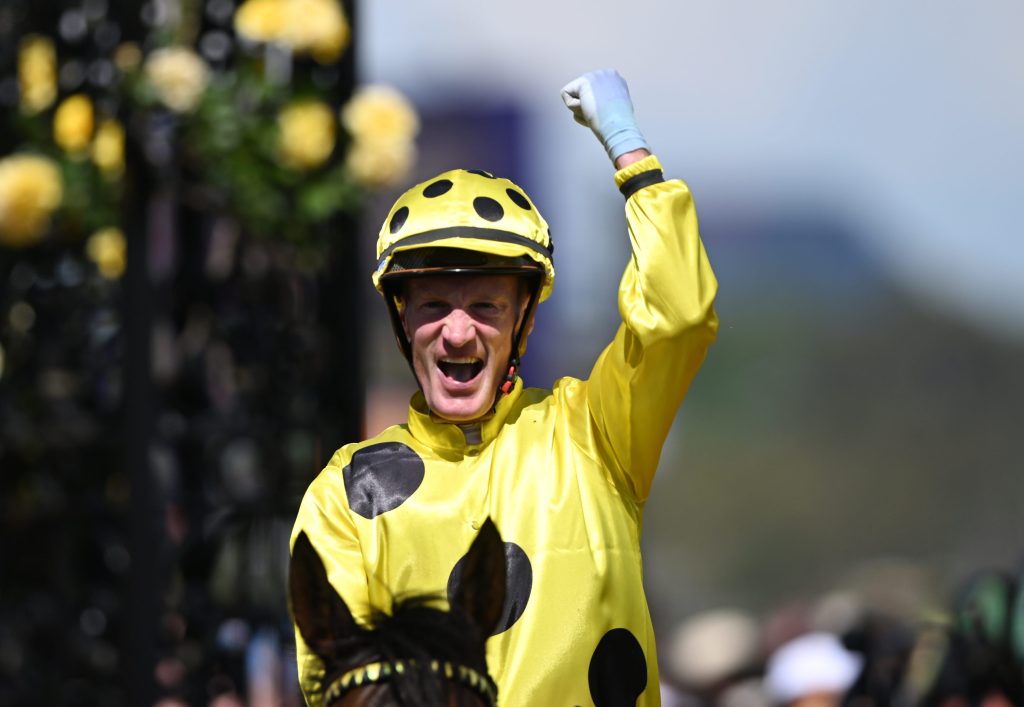 Jockey Mark Zahra celebrates after riding Without a Fight to victory in race 7, the 2023 Melbourne Cup, during Melbourne Cup Day at Flemington Racecourse in Melbourne, Wednesday, May 1, 2019. (AAP Image/Jame Ross)