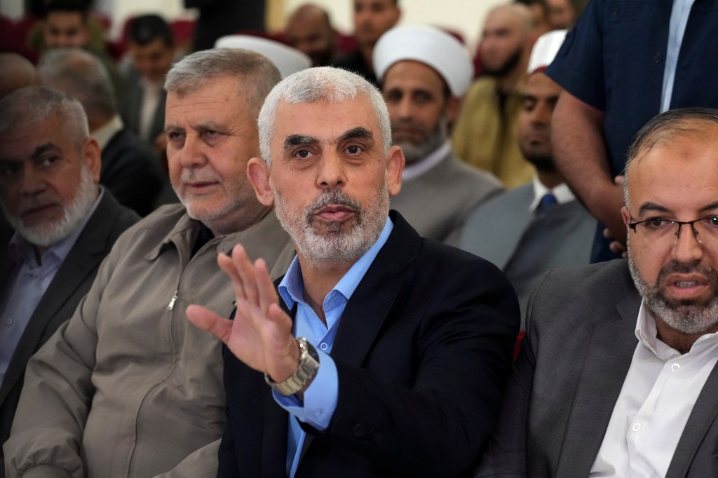 FILE - Yahya Sinwar, head of Hamas in Gaza, greets his supporters upon his arrival at a meeting in a hall on the sea side of Gaza City, on April 30, 2022. Since Hamas fighters carried out the deadliest attack on Israel in decades, Israeli officials have vowed to crush the Palestinian militant group and its enigmatic leader in Gaza, Yahya Sinwar. But seven weeks into the war, 61-year-old Sinwar remains alive, in hiding and at the helm of Hamas’ fighters as they battle Israeli forces. (AP Photo/Adel Hana, File)