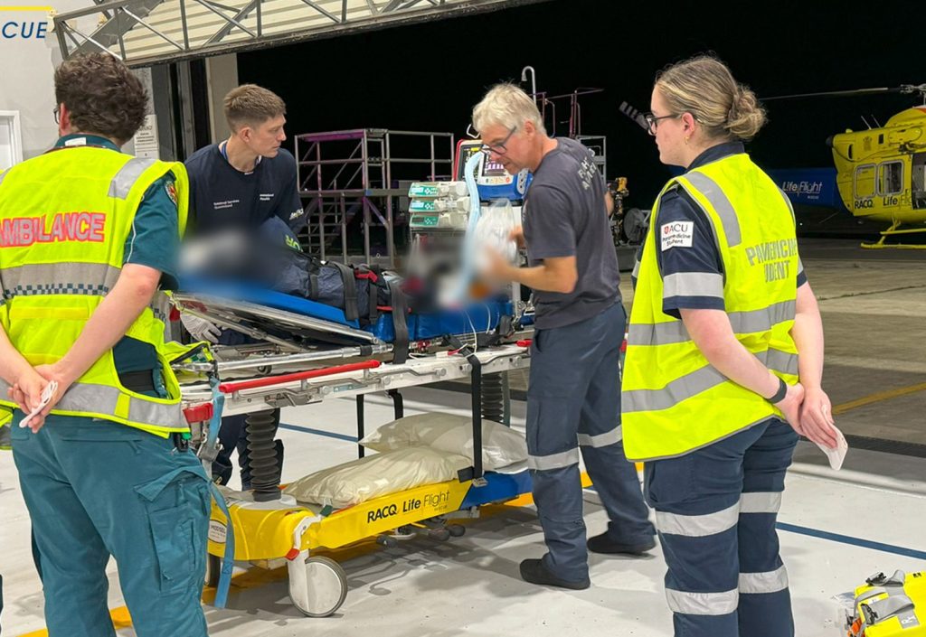 Paramedics prepare to airlift a toddler to a Brisbane hospital after the two year old was critically injured in a car rollover on Queensland's Sunshine Coast. (AAP Image/Supplied by RACQ LifeFlight Rescue) 