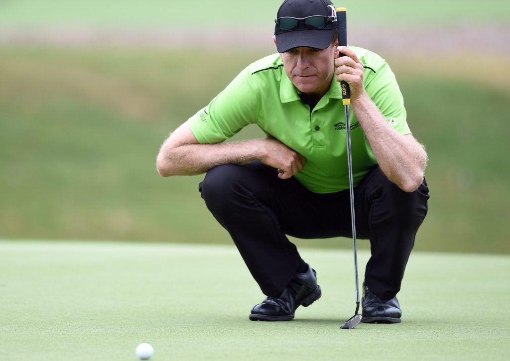 Australia's Michael Wright lines up a putt on the 7th hole during round 1 for the Australian Open Golf Championship. (AAP Image/Paul Miller) 