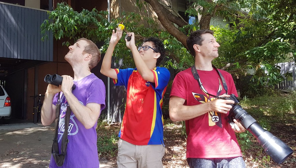 Dr Matthew Holden, Dr Russell Yong and Dr Andrew Rogers searching for species in their backyard. (AAP Image/Supplied by University of Queensland) 