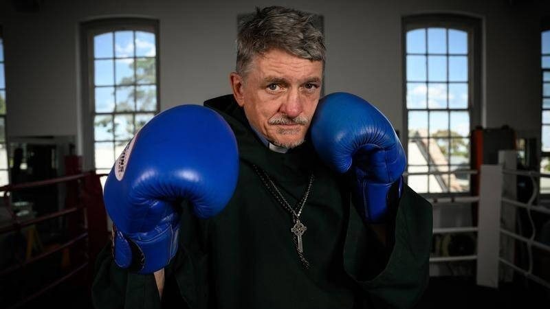 Father Dave Smith is fighting for a better future, in and out of the ring. (Image: Dan Himbrechts/AAP)